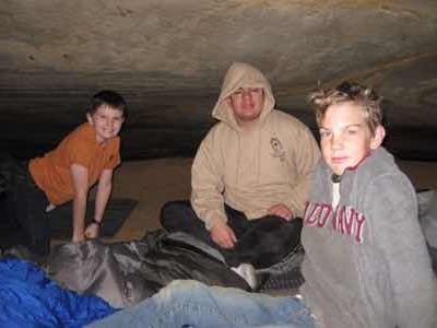 boys camping underground